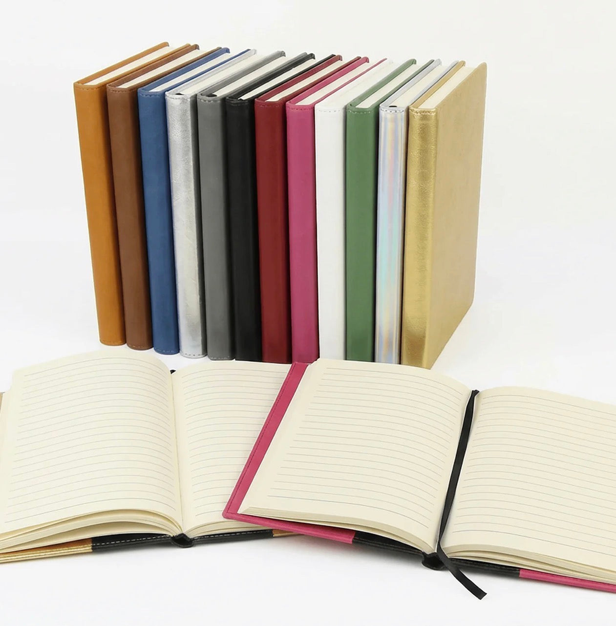 Set of colorful notebooks with one open on a white background